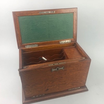 Lot 379 - AN EARLY 20TH CENTURY OAK STATIONARY BOX