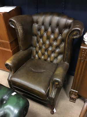 Lot 531 - A BROWN LEATHER WING BACKED ARMCHAIR