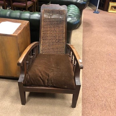 Lot 541 - A PAIR OF EARLY 20TH CENTURY CANE PANELLED RECLINER ARMCHAIRS