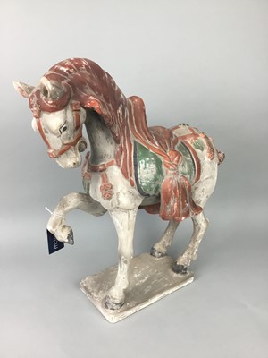 Lot 557 - A CHINESE STYLE MODEL OF A TANG HORSE