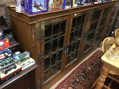 Lot 588 - AN OAK FOUR DOOR BOOKCASE