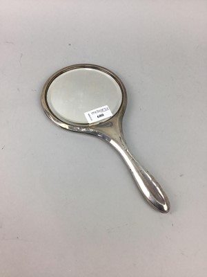 Lot 680 - A SILVER BACKED HAND MIRROR