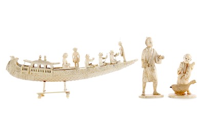 Lot 717 - AN EARLY 20TH CENTURY INDIAN IVORY CARVING OF A BOAT AND TWO FIGURES