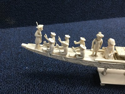 Lot 717 - AN EARLY 20TH CENTURY INDIAN IVORY CARVING OF A BOAT AND TWO FIGURES