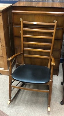 Lot 727 - A STAINED WOOD LADDER BACK ROCKING CHAIR AND A WALNUT CHEST OF DRAWERS