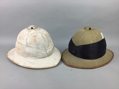 Lot 746 - A LOT OF TWO VINTAGE PITH HELMETS, A BOWLER HAT, TROUSERS AND A COAT