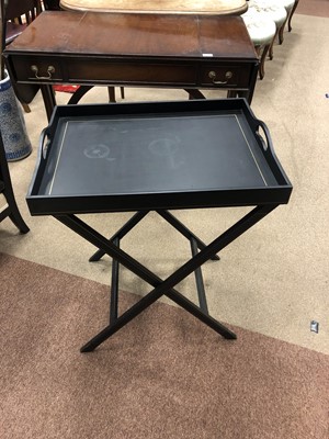 Lot 766 - AN EBONISED BUTLERS TRAY ON FOLDING STAND