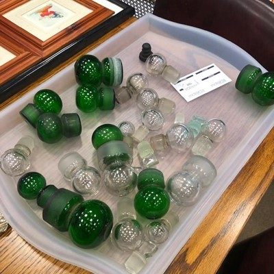 Lot 709 - A COLLECTION OF GREEN AND CLEAR GLASS BOTTLE STOPPERS