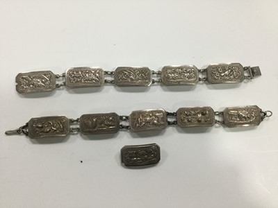 Lot 722 - A LOT OF TWO CHINESE WHITE METAL BRACELETS AND A BROOCH