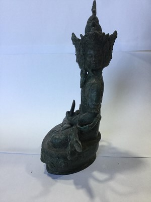 Lot 745 - AN EASTERN BRONZED FIGURE OF A SEATED DEITY