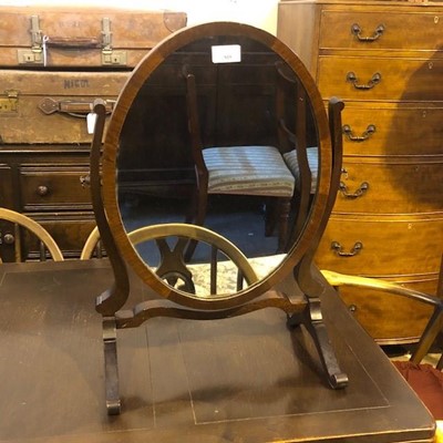 Lot 815 - A MAHOGANY OVAL DRESSING MIRROR