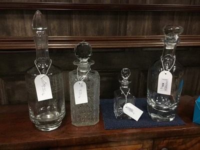 Lot 826 - A LOT OF FOUR CRYSTAL AND GLASS DECANTERS WITH STOPPERS