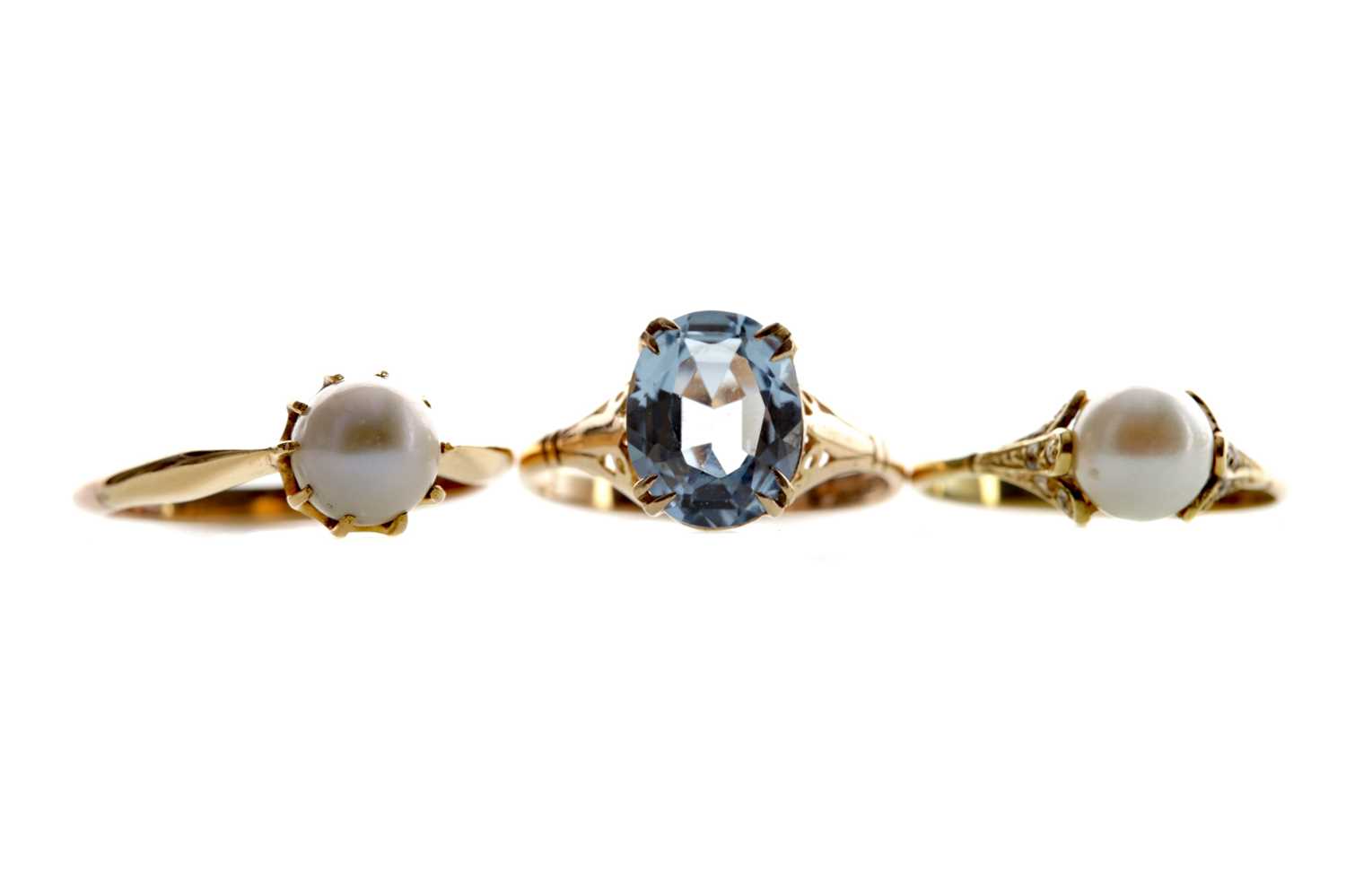 Lot 1372 - TWO PEARL RINGS AND A BLUE GEM SET RING
