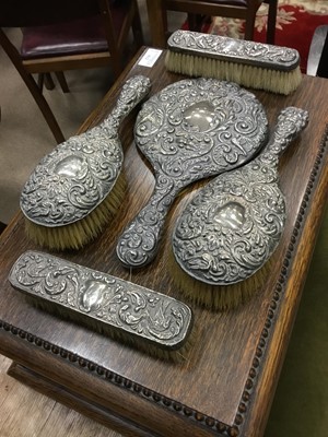 Lot 851 - AN EMBOSSED SILVER FIVE PIECE VANITY SET