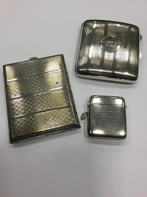 Lot 854 - A LOT OF THREE SILVER CIGARETTE CASES AND TWO VESTA CASES