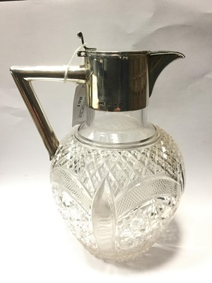 Lot 861 - A SILVER AND CRYSTAL CLARET JUG