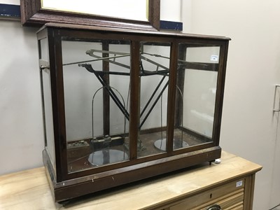 Lot 901 - A VINTAGE SET OF SCALES IN A DISPLAY CASE