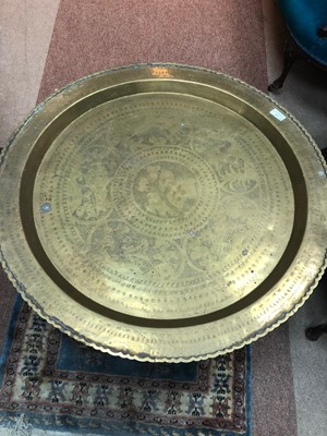 Lot 260 - AN EASTERN BRASS TOPPED TABLE