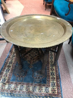 Lot 260 - AN EASTERN BRASS TOPPED TABLE