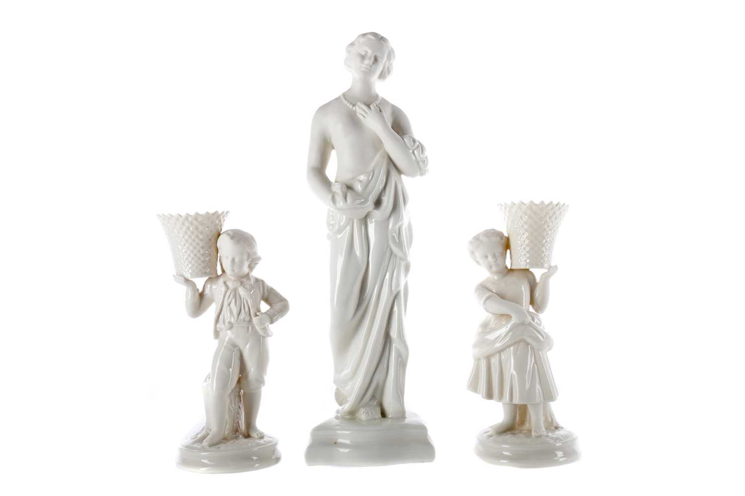 Lot 1102 - A BELLEEK FIGURE OF MEDITATION ALONG WITH A PAIR OF FIGURES
