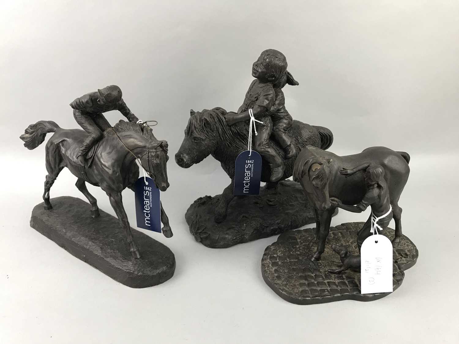 Lot 164 - A LOT OF THREE BRONZED RESIN EQUESTRIAN FIGURES