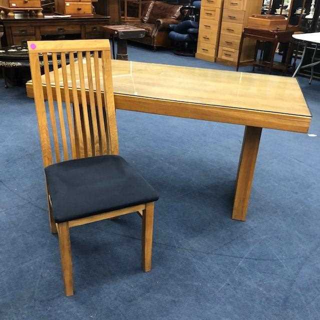 Lot 109 - A MODERN OAK DINING TABLE AND FOUR CHAIRS