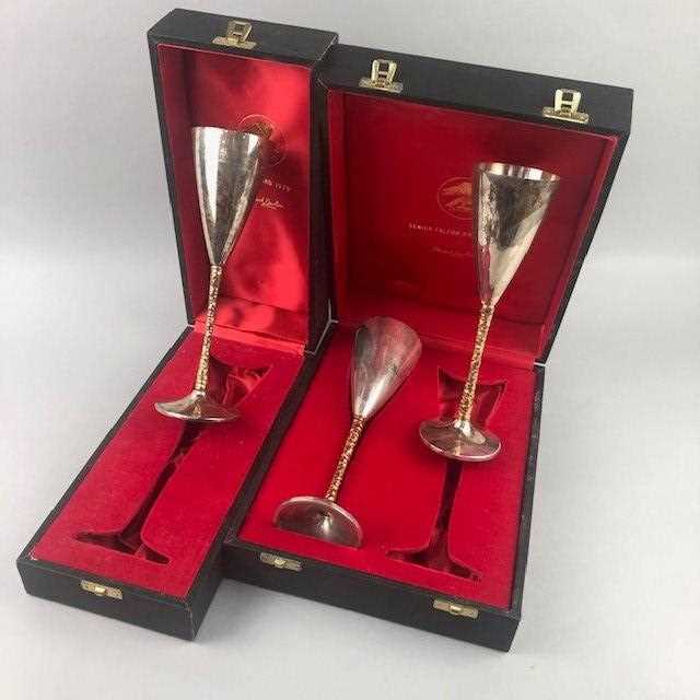 Lot 108 - A PAIR OF SILVER CHAMPAGNE FLUTES AND ANOTHER