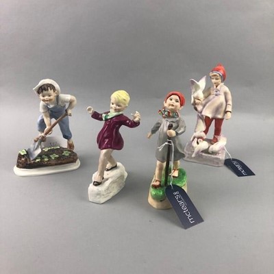 Lot 332 - A ROYAL WORCESTER FIGURE OF 'NOVEMBER' AND THREE OTHERS