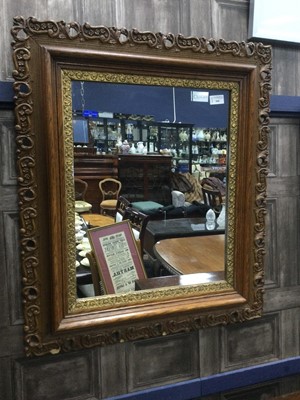 Lot 446 - A CARVED WOOD AND BRASS FRAMED RECTANGULAR WALL MIRROR