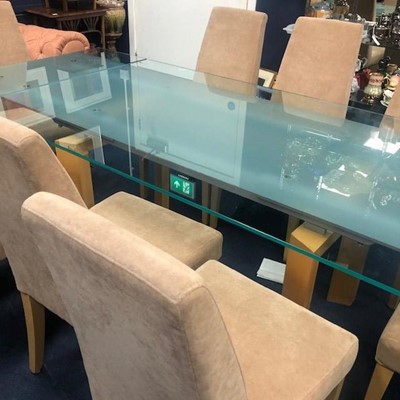 Lot 455 - A MODERN GLASS TOP EXTENDING DINING TABLE AND EIGHT CHAIRS