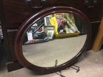Lot 129 - A CARVED WOOD FRAMED OVAL WALL HANGING MIRROR AND ANOTHER TWO MIRRORS