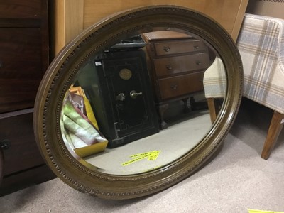 Lot 129 - A CARVED WOOD FRAMED OVAL WALL HANGING MIRROR AND ANOTHER TWO MIRRORS
