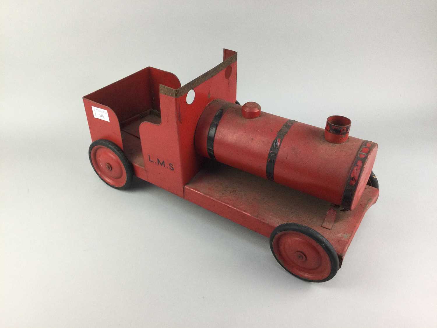 Lot 126 - A RED TIN PLATE MODEL TRAIN