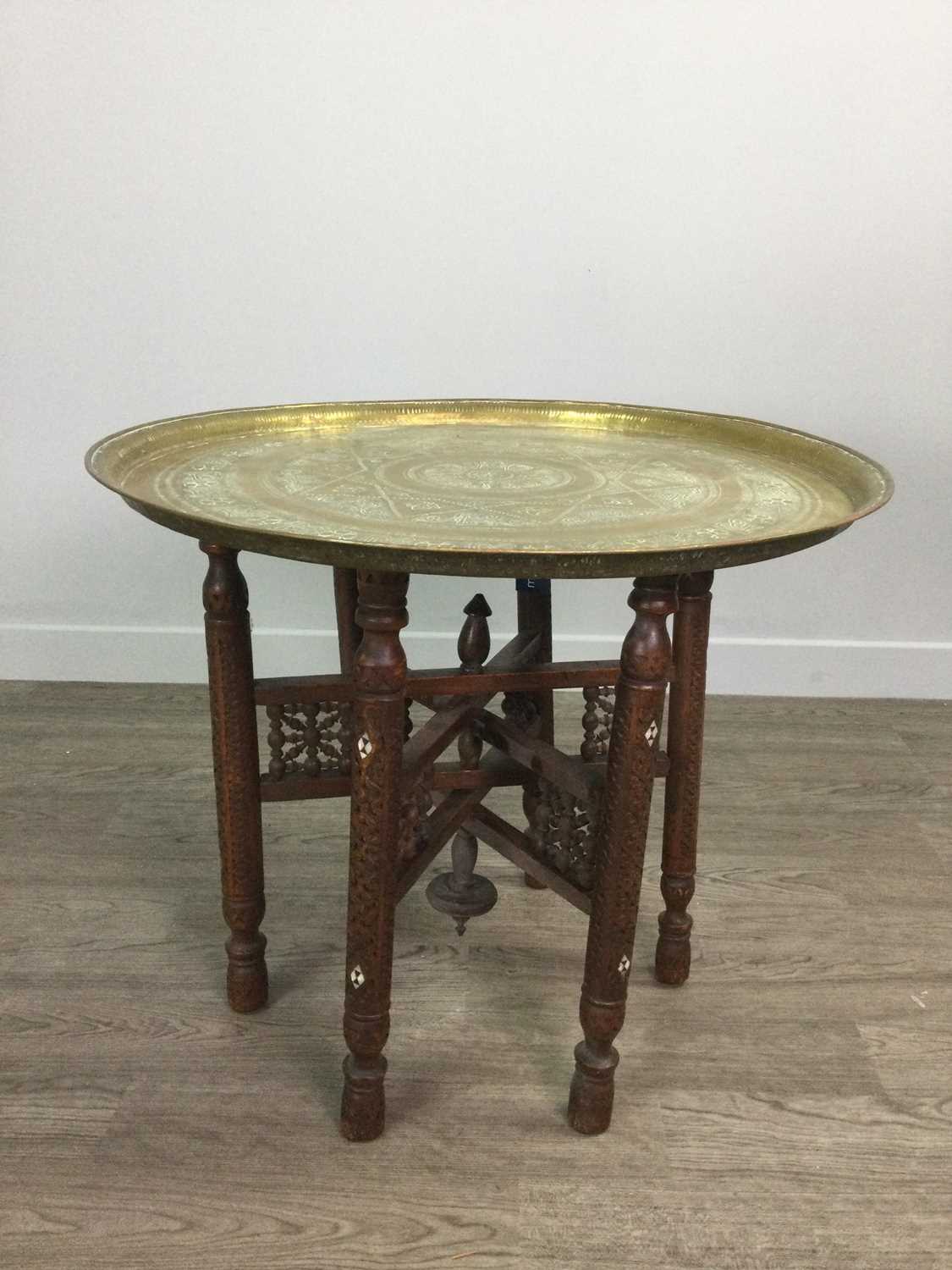 Lot 732 - AN INDIAN BRASS TABLE ON FOLDING STAND