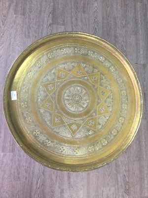 Lot 732 - AN INDIAN BRASS TABLE ON FOLDING STAND