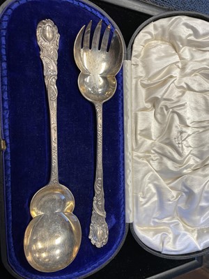 Lot 422 - A PAIR OF LATE VICTORIAN SILVER SERVERS