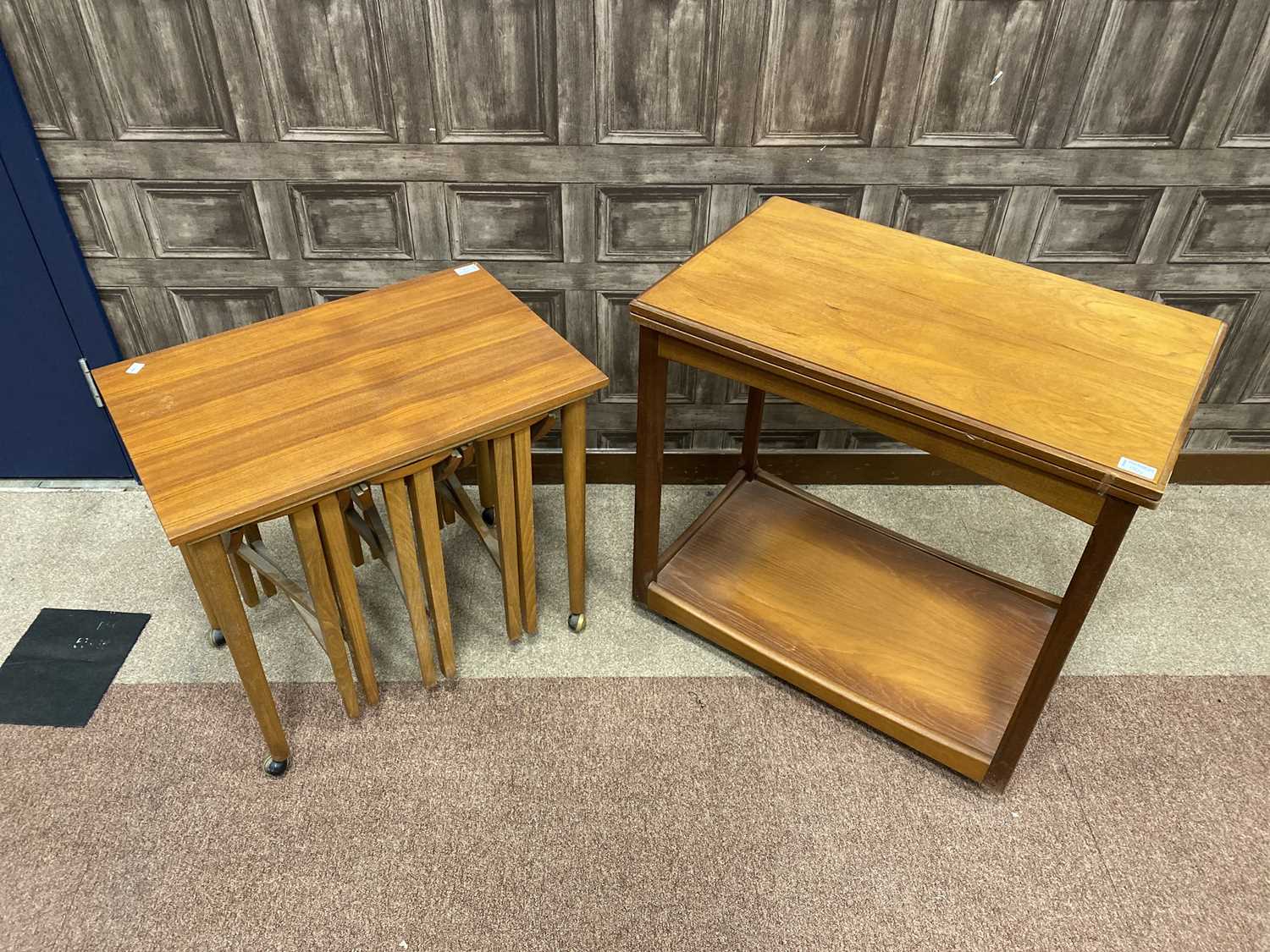 Lot 101 - A TEAK NEST OF TABLES, A TURN OVER TEA TABLE AND A DROP LEAF TABLE