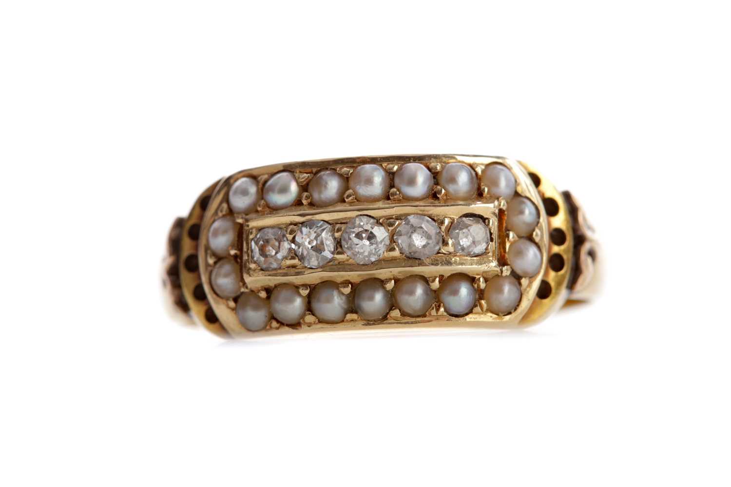 Lot 544 - A DIAMOND AND PEARL RING