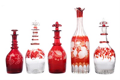 Lot 428 - A COLLECTION OF FIVE LATE 19TH CENTURY BOHEMIAN CRANBERRY GLASS DECANTERS, ALONG WITH NINE GLASSES