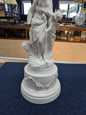 Lot 324 - A LATE VICTORIAN PARIAN WARE FIGURE GROUP