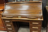 Lot 1084 - 1920s OAK ROLL TOP DESK enclosing a fitted...