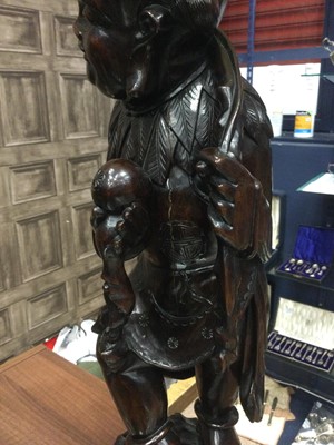 Lot 813 - AN EARLY 20TH CENTURY CHINESE HARDWOOD FIGURAL LAMP