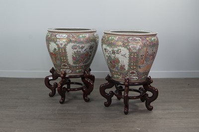 Lot 859 - A PAIR OF 20TH CENTURY CHINESE FAMILLE ROSE FISH BOWLS WITH STANDS