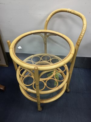 Lot 201 - A BAMBOO DRINKS TROLLEY AND MATCHING TABLE