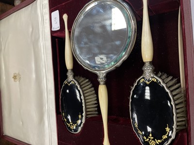 Lot 458 - A CASED GEORGE V SILVER AND ENAMEL DRESSING TABLE SET