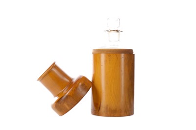 Lot 1357 - A 19TH CENTURY BOXWOOD CYLINDRICAL CASE HOUSING A GLASS BOTTLE