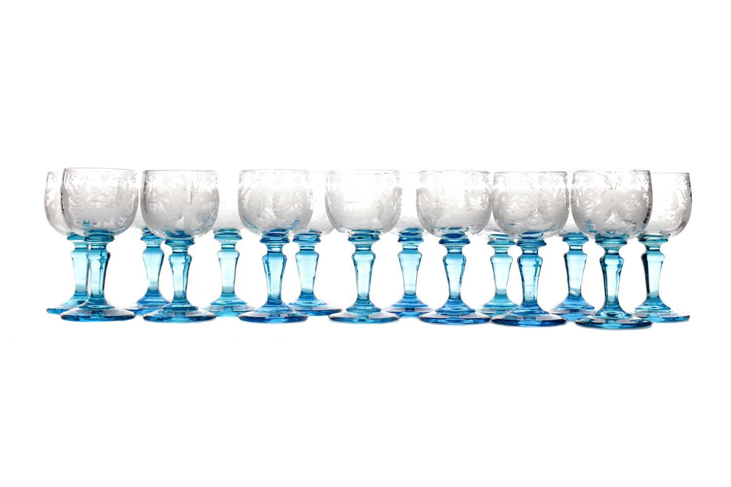 Lot 1049 - A SET OF CLEAR AND BLUE GLASS LIQUEUR GLASSES