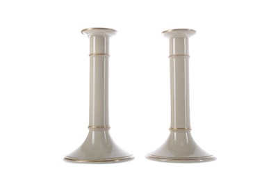 Lot 350 - A MATCHED SET OF THREE MID-19TH CENTURY DRABWARE CANDLESTICKS