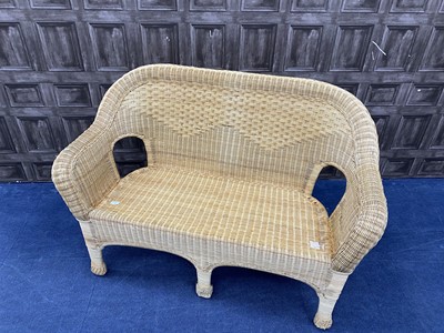 Lot 142 - A TWO SEAT WICKER SETTEE AND A GREEN LEATHER EASY CHAIR