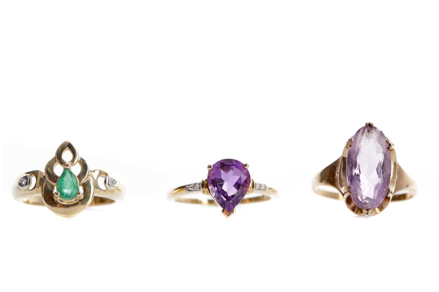 Lot 549 - TWO PURPLE GEM SET AND DIAMOND RINGS AND A GREEN GEM SET AND DIAMOND RING
